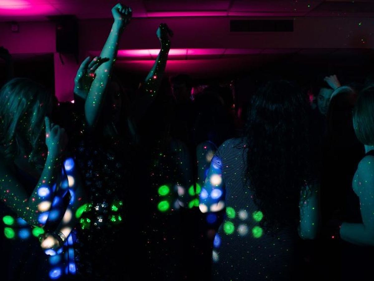 Guests enjoying an Iridescent Photo Booth at a quinceaneras event